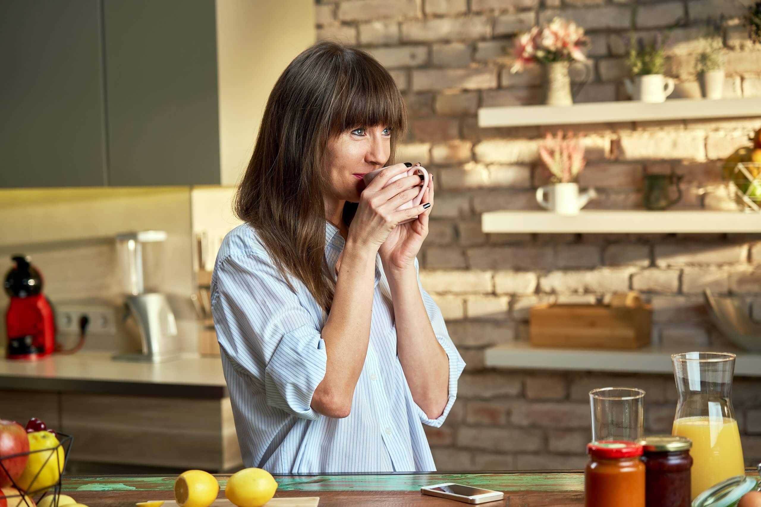 woman at home drinking coffee